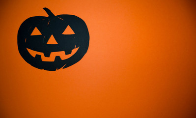 Halloween pumpkin on orange background. Poster or banner for Trick or Treat Halloween party with...