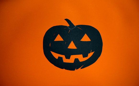 Halloween pumpkin on otange background. Poster or banner for Trick or Treat Halloween party with scary pumpkin.