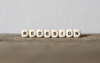 Word REDESIGN made with wood building blocks