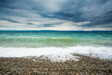 Pebble beach waves and storm