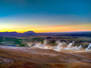 a lot of geysers in Iceland at sunset