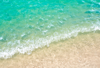White bubble of Sea wave on the beach