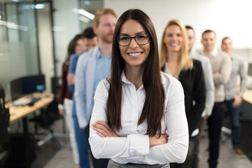 Obraz premium Successful team of young perspective businesspeople in office