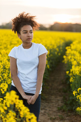 Sad Mixed Race African American Teenager Woman in Yellow Flowers
