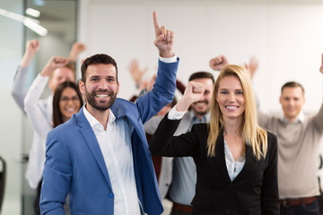 Successful team of young perspective businesspeople in office