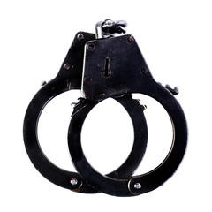 Closed black metal handcuffs isolated on white background