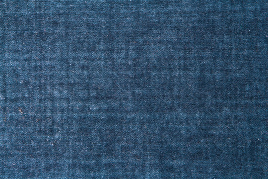 Texture of blue vintage fabric with a pattern in retro grunge style