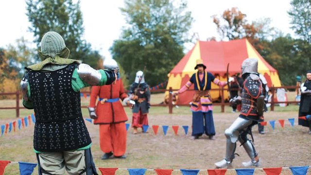 Medieval tournament and competition between two strong knights with steel swords