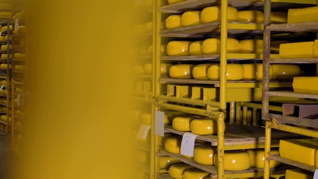 A cheese holding warehouse with wheels ready for shipment. 