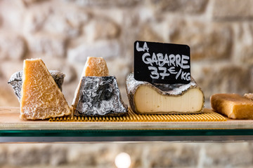 Cheeses on the counter of a small store. Paris, France - 175073890