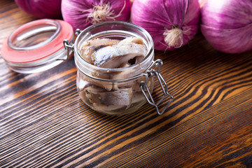 Marinated herring in a jar