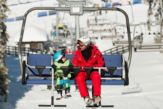 Father and son on ski lift