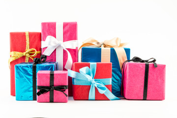 Big pile of colorful wrapped gift boxes isolated on white background. Mountain gifts. Beautiful present box with overwhelming bow. Christmas surprise icon. Happy new year decor, discounts, promotions.