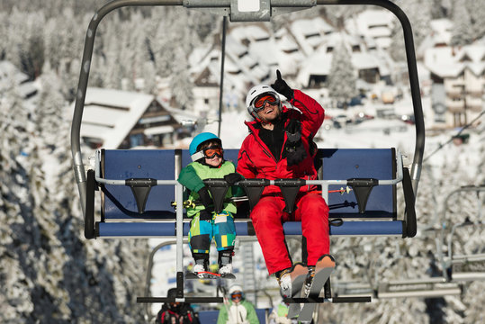 Father and son on ski lift