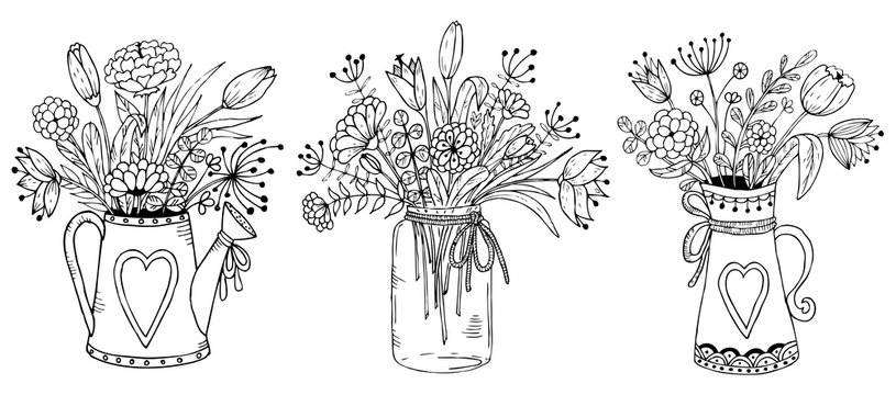 Three vases with floral bouquets.