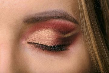 beautiful girl eyes with bright evening make-up.