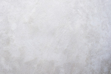 Scratched vintage or grunge white, gray, beige background of natural cement, plaster or stone. Old texture as a retro pattern wall