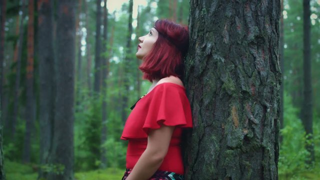 4K Hipster Woman in the Forest Looking Up