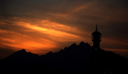 Sunset, mountains and minaret