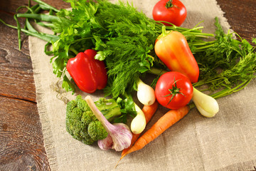 salad from fresh vegetables in a plate on a table, selective focus