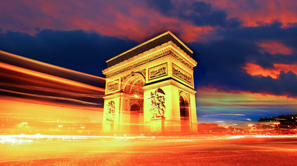 Famous Arc de Triomphe at night in Paris, France