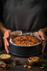 Woman holds traditional fruitcake