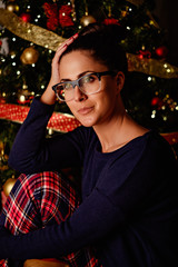 Portrait of a girl in front of christmas tree