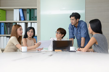 Fototapeta premium Group of business people having different age in creative business discussing work in the office