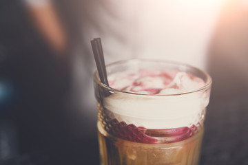 Bartender offers alcoholic cocktails in bar