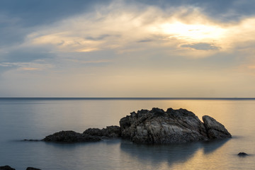 Fototapeta na wymiar Seascape and Blue sky with Rock clam smooth sea