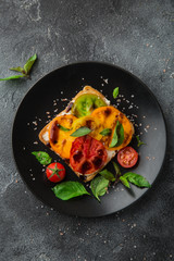 colorful tomatoes sandwich with basil and basamic vinegar