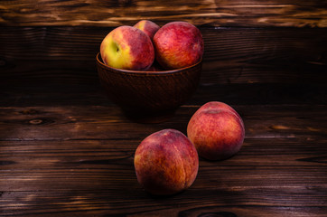 Fresh ripe peaches on wooden table
