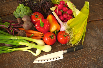 salad from fresh vegetables in a plate on a table, selective focus
