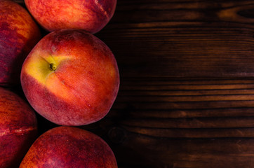 Fresh ripe peaches on wooden table. Top view