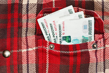 Russian rubles notes in checkered jacket pocket