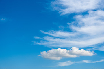 Sunny weather with cumulus clouds on blue sky
