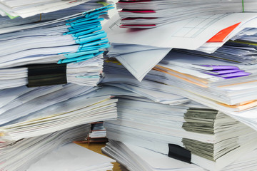 Paper documents stacked in archive