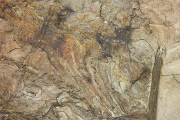 stone surface with the natural pattern and stains close up