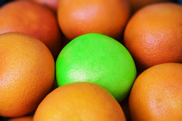 Closeup of a pile of ripe grapefruit. Difrent concept.