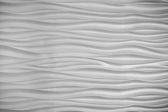 Abstract background: white wavy texture.