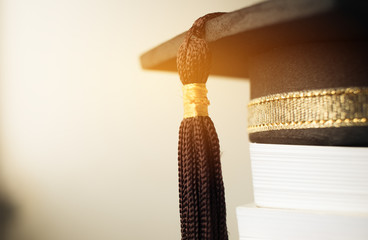 Graduation cap on Books step in Library room of campus and university, Concept of abroad...