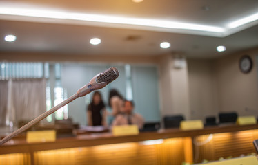 Blurred of Speaker mini mic, Microphone in Conference room or seminar meeting hall in business...