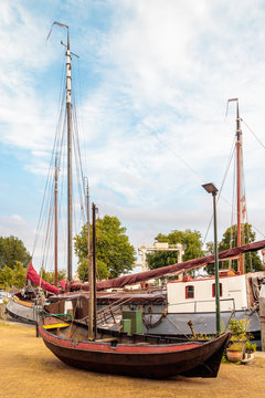 Ancient restored sailing boat in the Dutch harbor of Gouda
