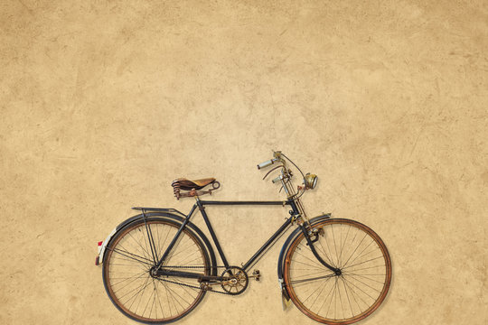 Vintage bicycle in front of a sepia background