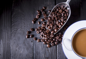 Coffee beans on black wood table