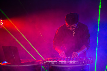 Dj was remix music in pub, Man with Dj concept. Attractive Man Remixed Music alone.