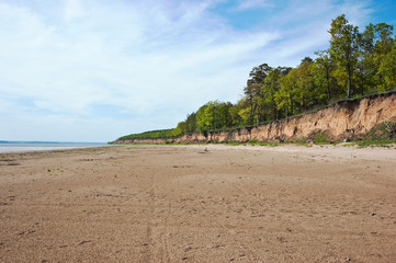 wide sandy shore of the river