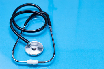 stethoscope on blue background.