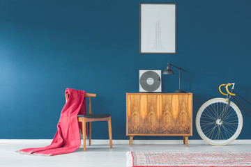Blanket sliding from retro chair