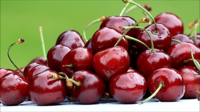 red juicy cherries rotating, fresh ripe fruit
